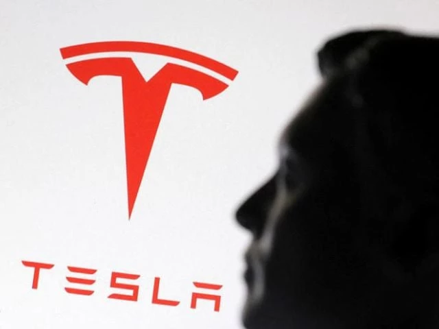 a 3 d printed miniature model of musk and tesla logo photo reuters