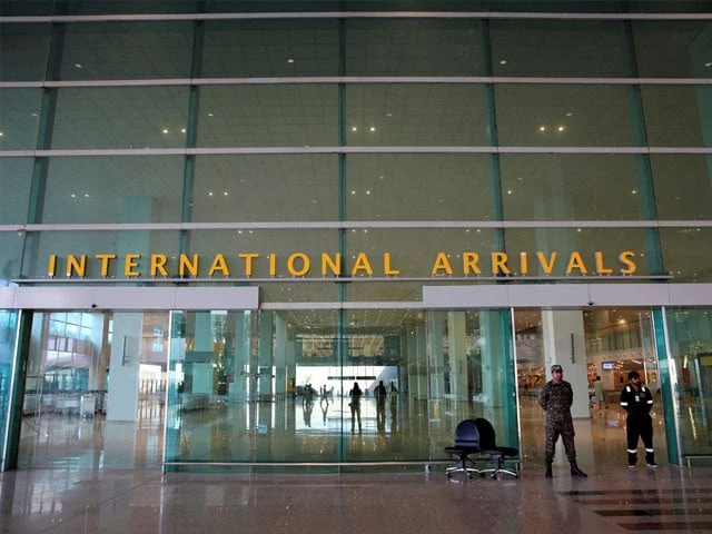 airport security force asf personnel stand guard at the international arrivals of islamabad international airport photo reuters