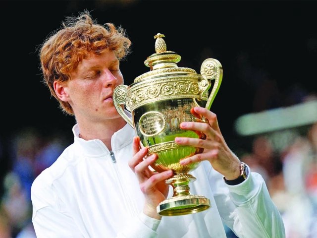 italy s jannik sinner celebrates with the trophy after winning the wimbledon men s final against spain s carlos alcaraz in london file photo reuters