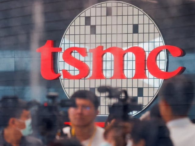 taiwan semiconductor manufacturing company s tsmc logo is seen while people attend the opening of the tsmc global r d center in hsinchu taiwan july 28 2023 photo reuters