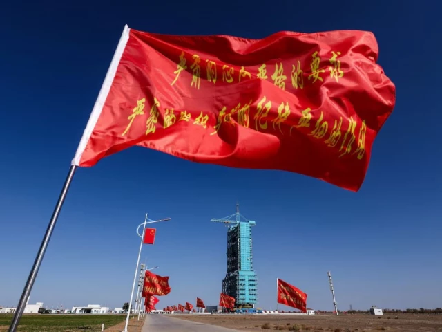 flags fly along the road near the launch pad for the long march 2f rocket ahead of the shenzhou 21 spaceflight mission to china s tiangong space station at the jiuquan satellite launch center near jiuquan gansu province china october 30 2025 photo reuters