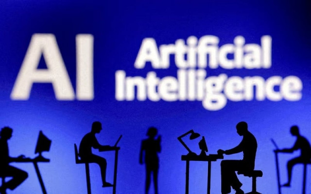 figurines with computers and smartphones are seen in front of the words artificial intelligence ai in this illustration taken february 19 2024 photo reuters