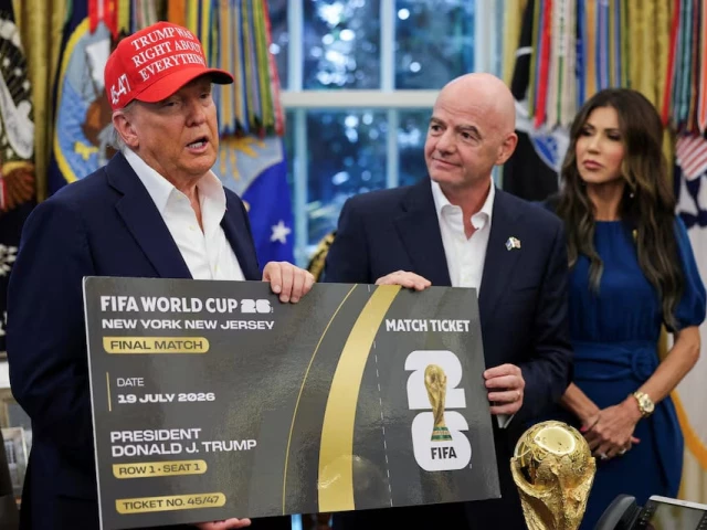 2026 fifa world cup final match ticket that was presented to president trump as the president makes an announcement on the 2026 fifa world cup while u s homeland security secretary kristi noem stands in the oval office at the white house in washington photo reuters