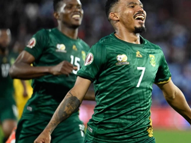 oswin appollis r celebrates scoring to give south africa victory over zimbabwe in marrakesh photo afp