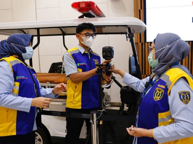 airport health authorities wearing protective masks prepare a thermal imager at soekarno hatta international airport following the implementation of health screening for arriving passengers after india confirmed two cases of the deadly nipah virus in tangerang near jakarta indonesia january 30 2026 reuters