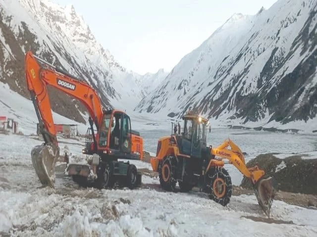 workers of kaghan development authority use heavy machinery to clear the road leading to the scenic lake saiful malook balakot following its reopening to tourists after six months photo zulfiqar ali express