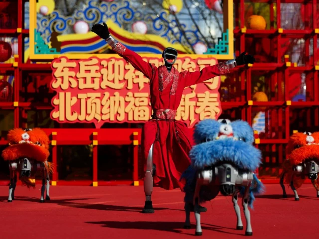 a humanoid robot performs a dance with robot dogs dressed in lion costumes on the first day of the lunar new year of the horse at the niangniang temple in beijing china february 17 2026 photo reuters