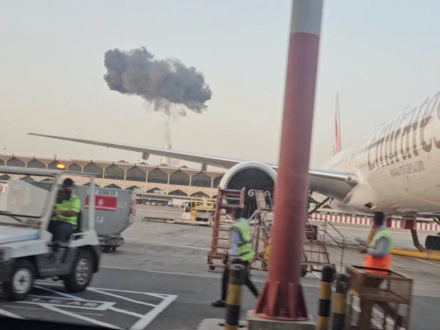 plume of smoke rises around dubai creek area as seen from dubai international airport in dubai united arab emirates march 7 2026 photo reuters