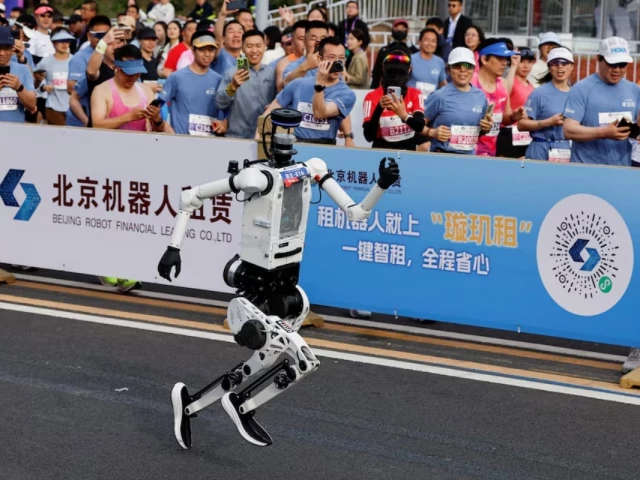 tiangong ultra 2026 humanoid robot takes part during the second beijing e town half marathon and humanoid robot half marathon in beijing china april 19 2026 reuters