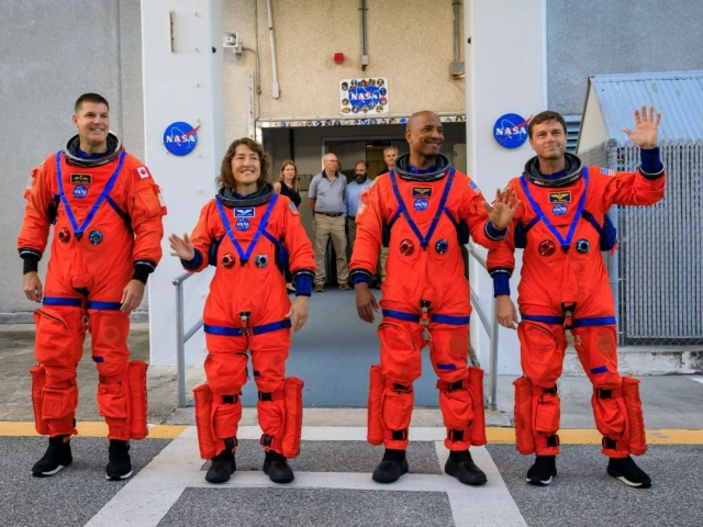 artemis ii crew members from left csa canadian space agency astronaut jeremy hansen and nasa astronauts christina koch victor glover and reid wiseman walk out of astronaut crew quarters inside the neil armstrong operations and checkout building to the artemis crew transportation vehicles prior to traveling to launch pad 39b as part of an integrated ground systems test at kennedy space center in florida on sept 20 2023 to test the crew timeline for launch day photo nasa