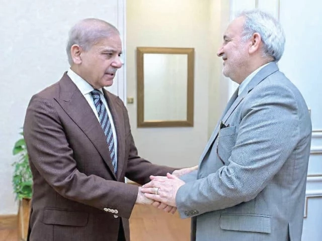 prime minister shehbaz sharif shakes hands with iran ambassador to pakistan dr reza amiri moghadam during a meeting in islamabad photo online
