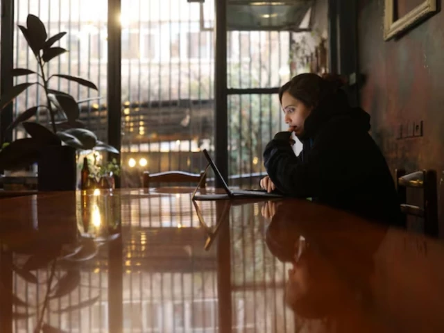 an iranian woman samaneh tries to connect to the internet to check on her visa status for her migration process after a nationwide internet shutdown since january 8 2026 photo reuters