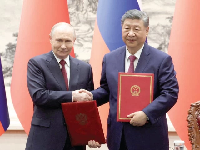 chinese president xi jinping and russian president vladimir putin shake hands during a signing ceremony at the great hall of the people in beijing photo reuters