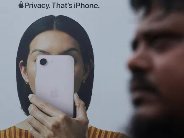 a man walks past an apple iphone hoarding on a street in mumbai india photo reuters