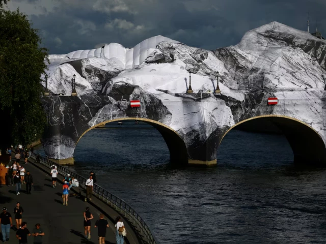 view of the damaged canvas of the temporary artwork la caverne du pont neuf the pont neuf cave conceived by french street artist jr as a tribute to christo and jeanne claude on the pont neuf bridge after strong winds in paris france june 2 2026 reuters sarah meyssonnier