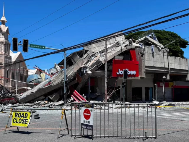 a road is blocked near the collapsed building after a magnitude 7 8 quake in general santos philippines june 8 2026 picture taken with a mobile phone photo reuters