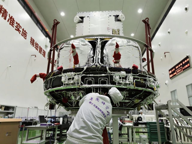 a technician checks the solar wind magnetosphere ionosphere link explorer smile at a workshop of the innovation academy for microsatellites of chinese academy of sciences cas in shanghai east china nov 4 2024 the smile is a joint mission between the cas and the european space agency esa that aims to deepen the understanding of the sun earth connection photo xinhua