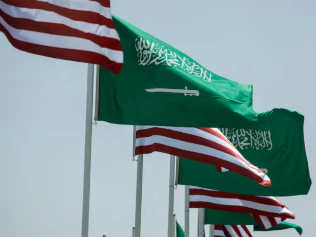 us and saudi flags flutter along a highway of riyadh as pictured through the glass of a car ahead of the arrival of us president donald trump to riyadh saudi arabia photo reuters