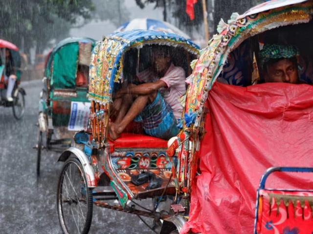 rickshaw drivers sit inside of their rickshaws to take cover during torrential rain in dhaka bangladesh july 7 2026 photo reuters