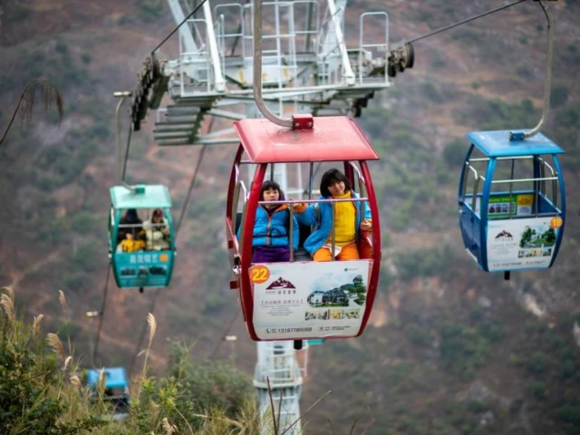 students from nizhuhe village take a cable car on their way to school in puli township xuanwei city southwest china s yunnan province xinhua jiang wenyao