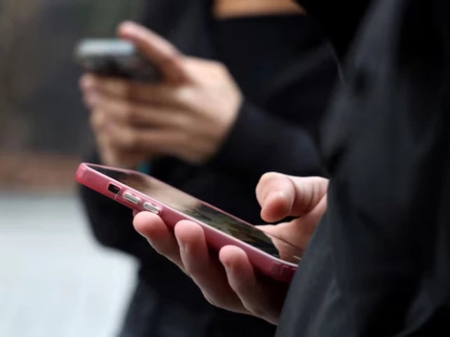 teenagers look at their mobile phone screens during an interview with reuters about the bill aimed at banning the use of social networks for those under 15 and mobile phones in high schools from the start of the 2026 school year in paris france february 20 2026 reuters