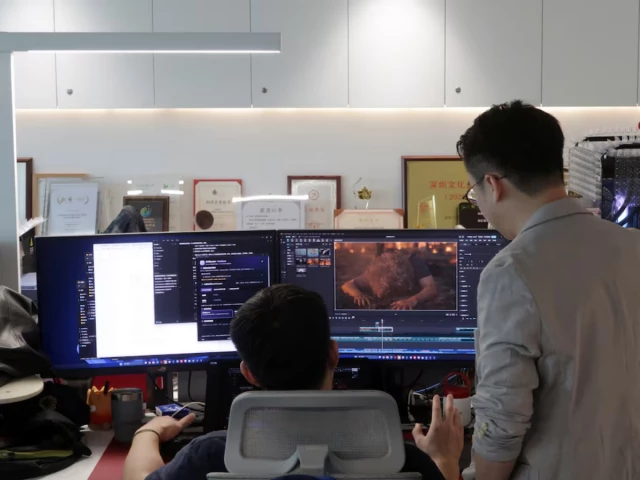 zhu zhili a chinese ai director discusses an ai generated video with a colleague at the office of china wit media a film and television production company in shenzhen guangdong province china photo reuters