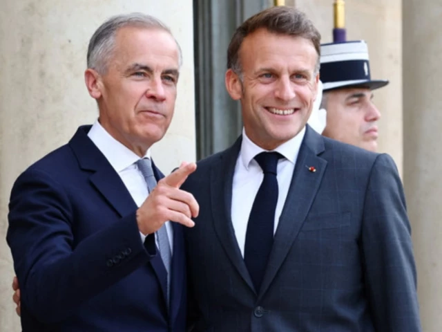 french president emmanuel macron shakes hands with canadian prime minister mark carney as he arrives for a meeting at the elysee palace in paris before the g7 summit in evian les bains france june 12 2026 photo reuters