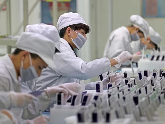 workers are seen at a production line manufacturing solar photovoltaic components at a factory in huzhou zhejiang province china february 12 2019 photo reuters