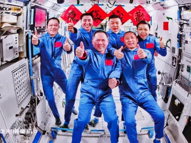this image captured at beijing aerospace control center on may 25 2026 shows a group picture of the crew of shenzhou 21 and shenzhou 23 spaceships photo xinhua